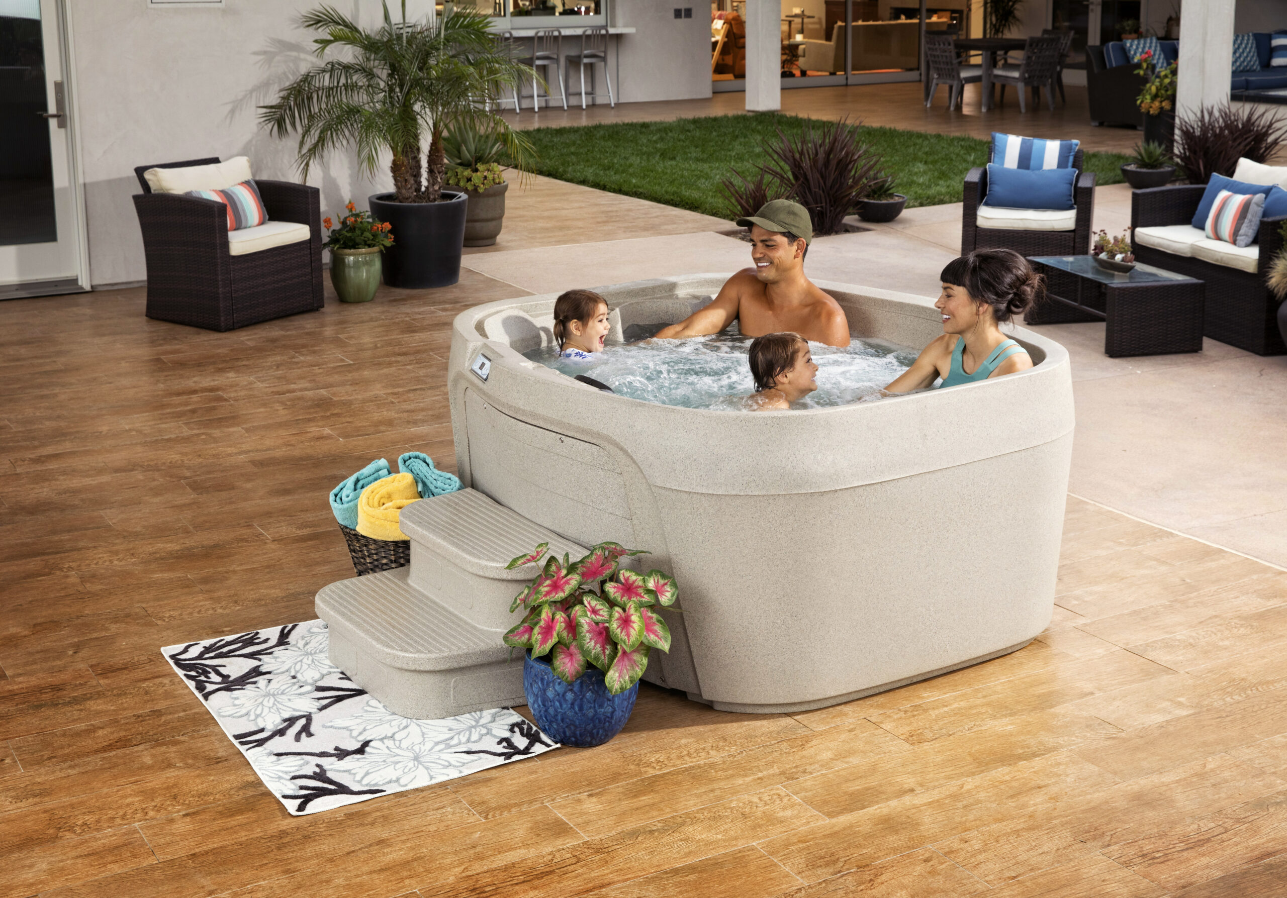 This is a lifestyle commercial photograph taken on location by Skip O'Donnell off ODonnell photograf of a Cascina hot tub for Watkins Spa in Solana Beach, San Diego, California